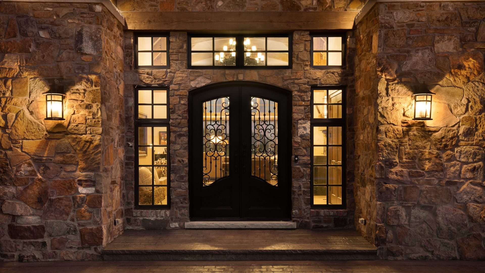 Stone home on all sides with black custom door in Bridgehampton, NY