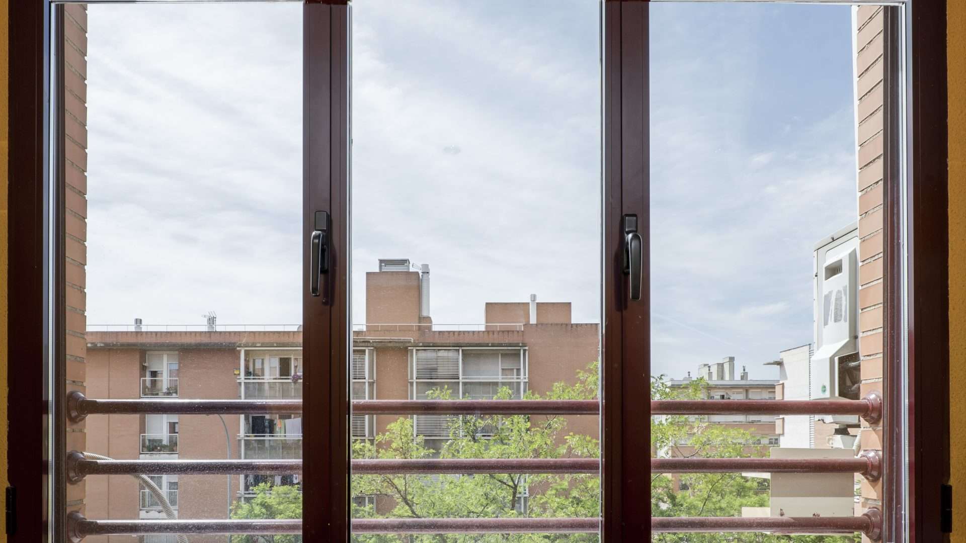 Interior of dark red windows of Bridgehampton, NY home