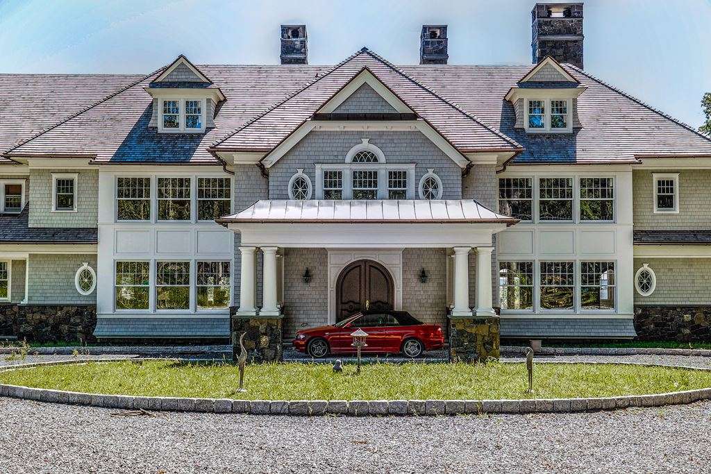 White-clad windows on a large Hamptons house
