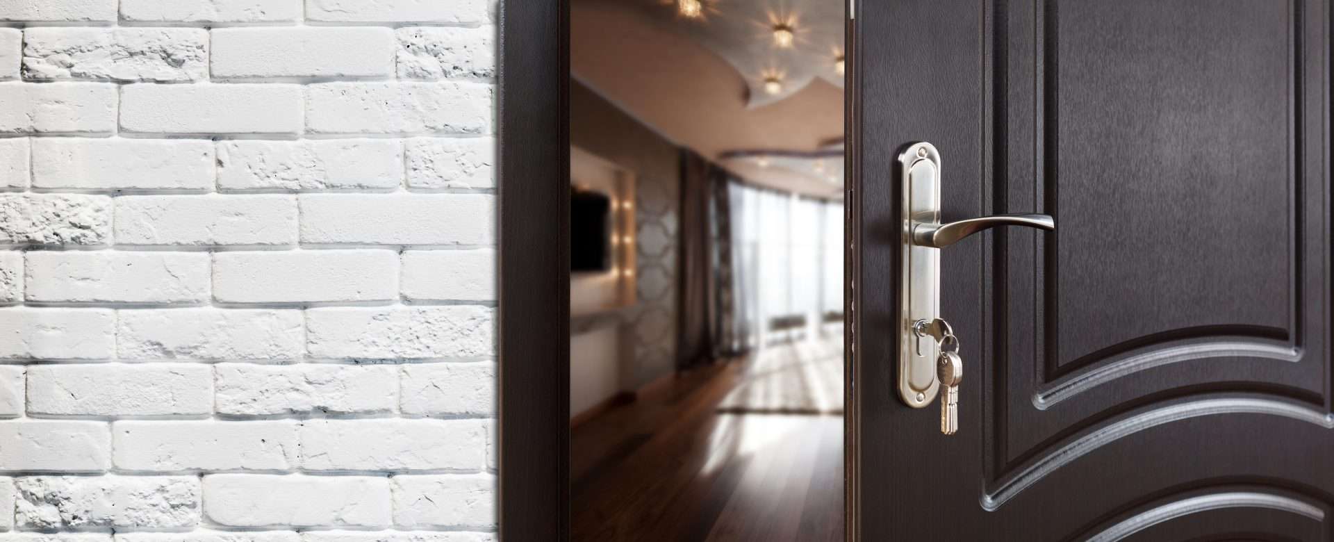 Half-opened aluminum door leading to the interior of modern house