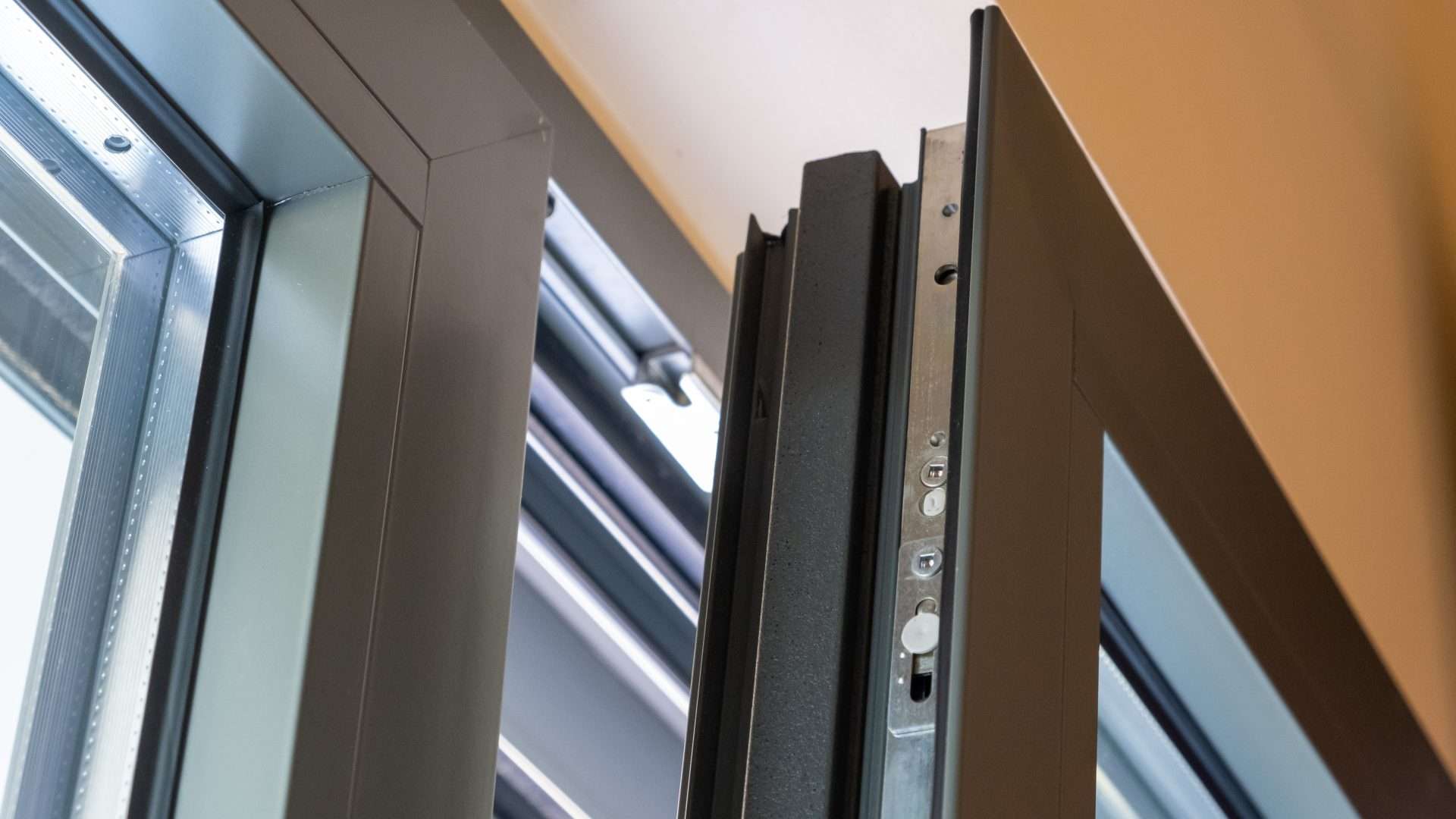 Close-up view of a modern aluminum window with multiple layers