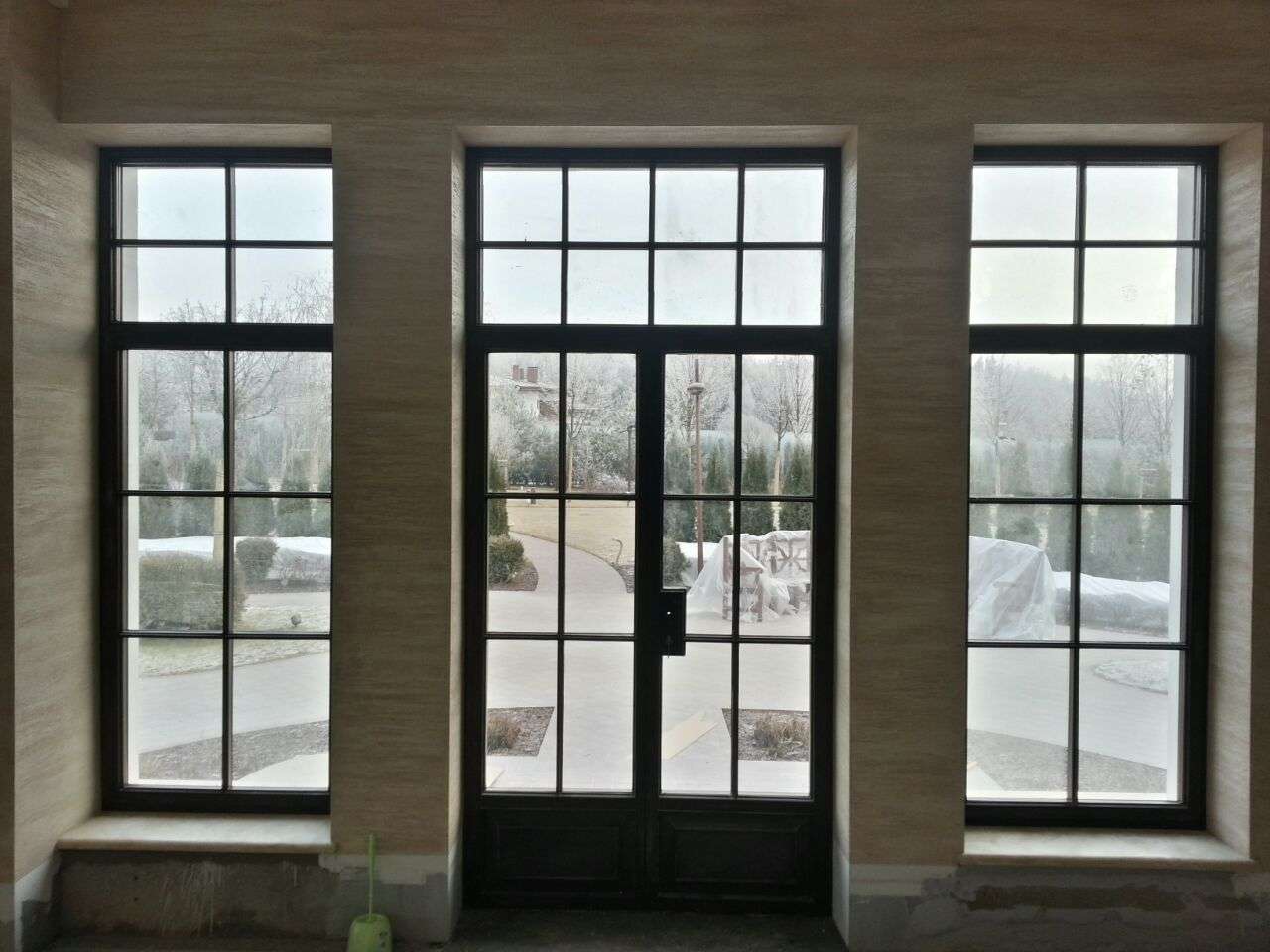 Black steel patio doors installed by Rockman Windows & Doors in Bedford, NY