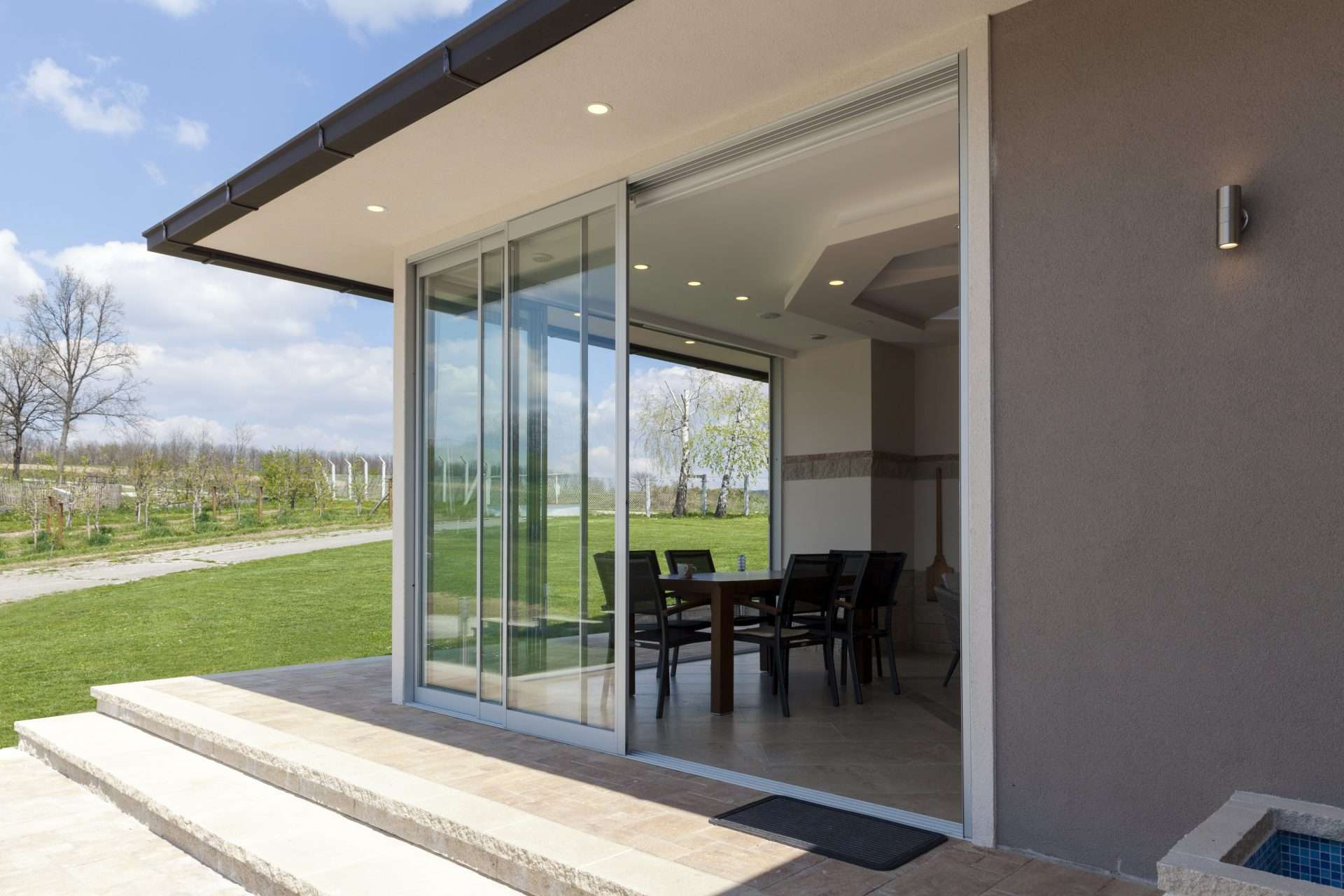Large sliding glass door leading to porch