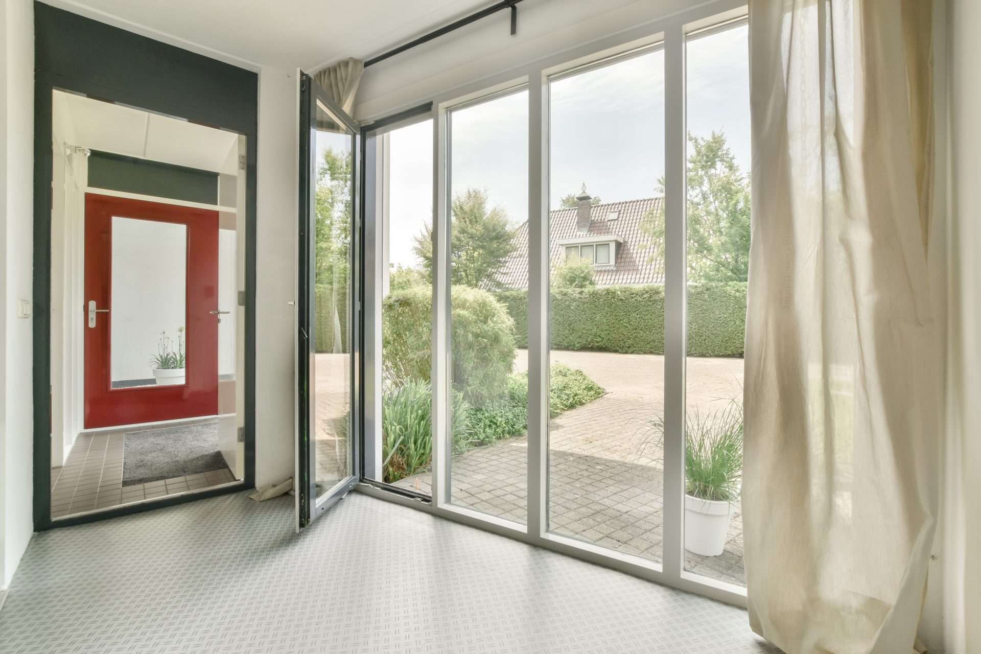 The image features a glass sliding exterior door in a kitchen going out to the backyard.