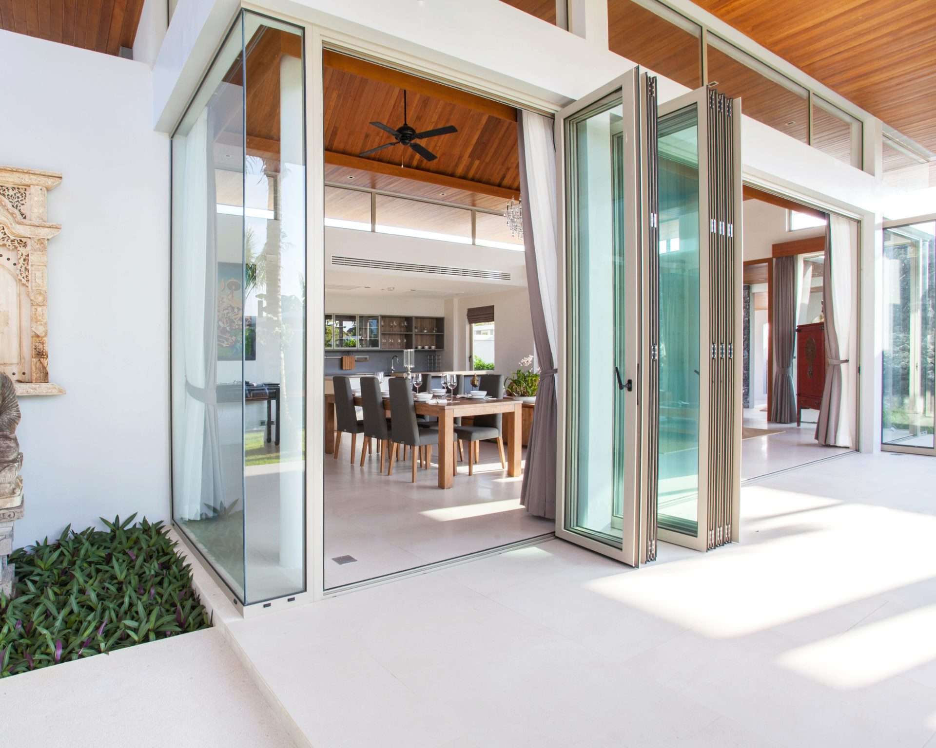 Large format door folded for access to patio in home