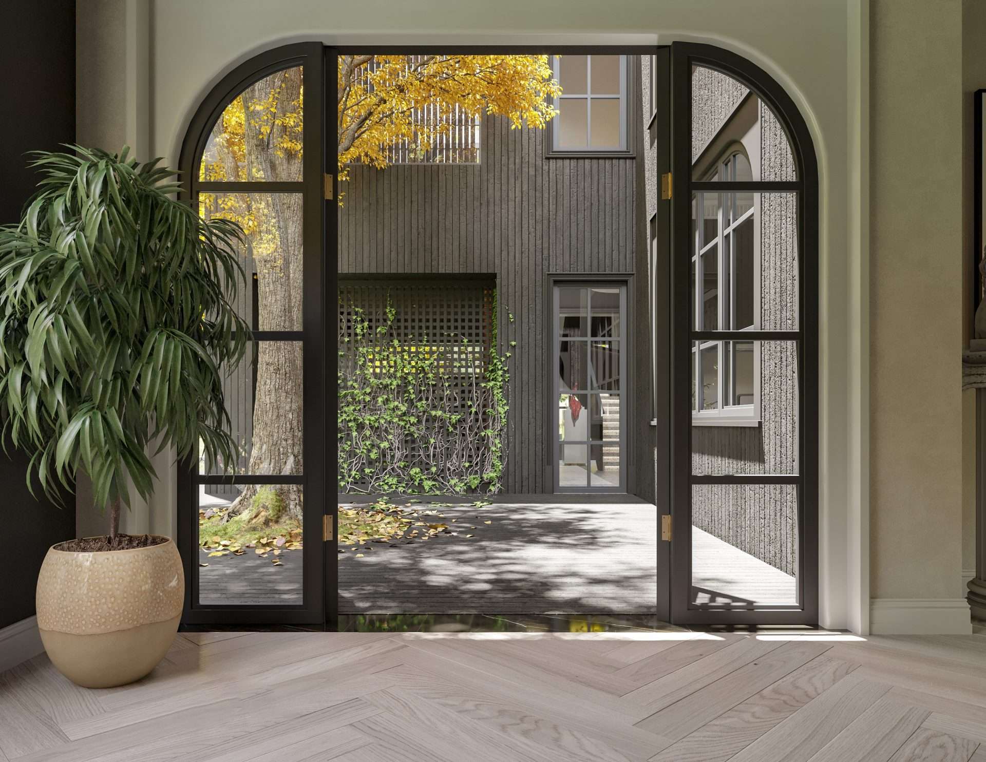 Large glass doors in an entryway to a house Tall rectangular windows on a stone wall with greenery.