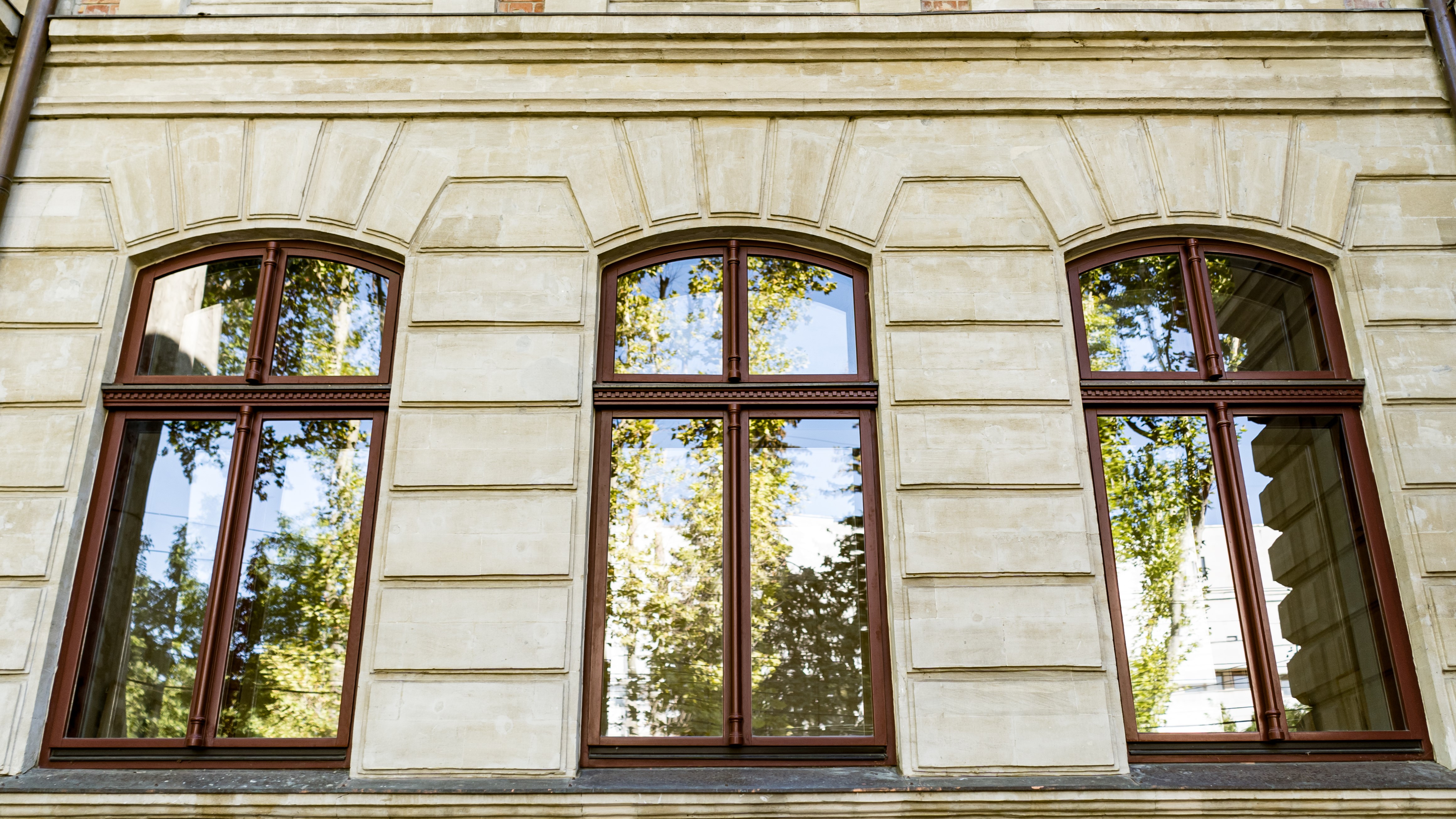 Stunning Wood Windows In Cold Spring, NY | Rockman Windows & Doors Three historic wood-frame windows in a stone building.