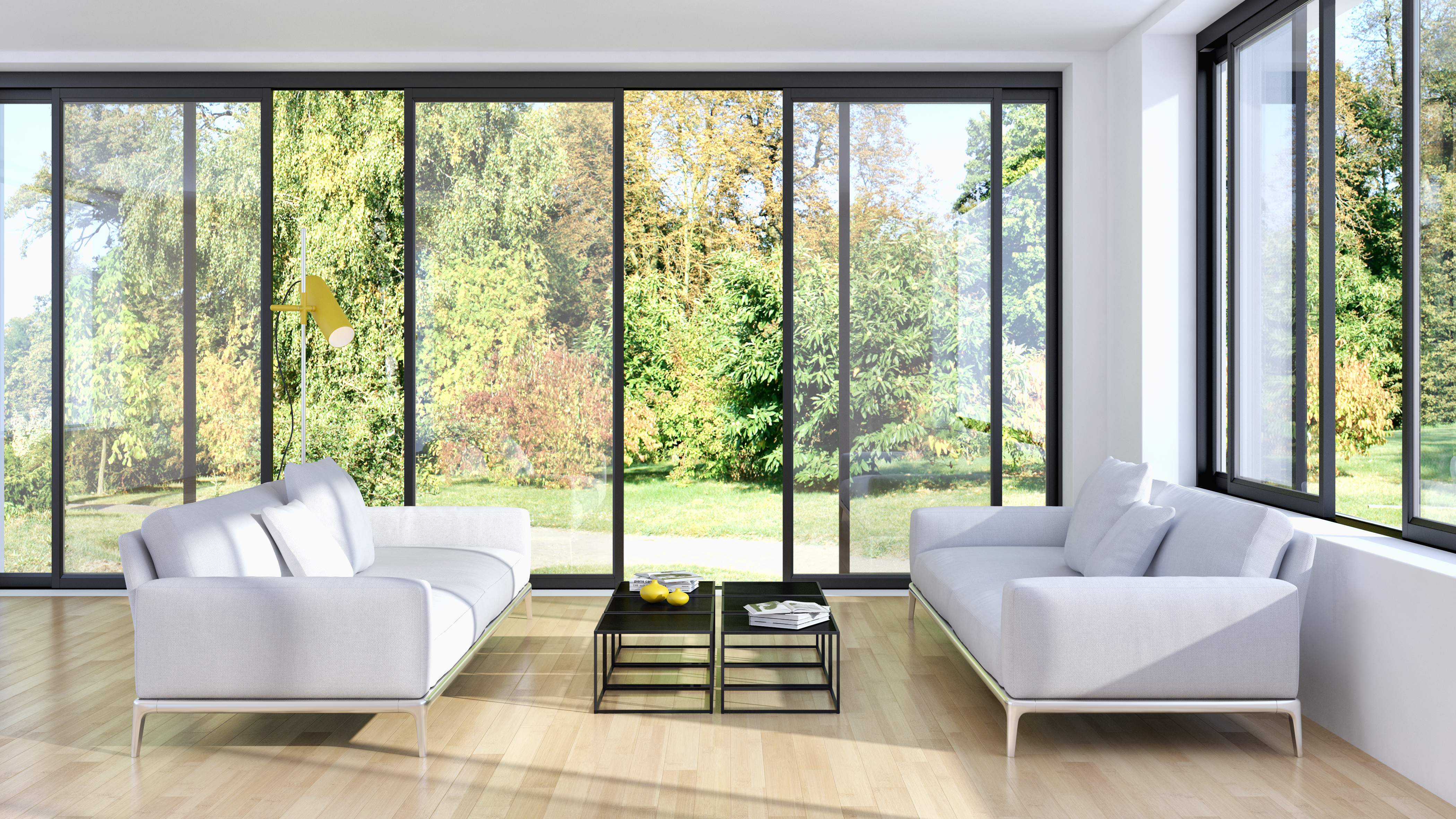 Modern Aluminum Doors in Scarsdale, NY | Rockman Windows & Doors A spacious living room with hardwood floors, contemporary white sofas, and black-framed aluminum doors partially open.