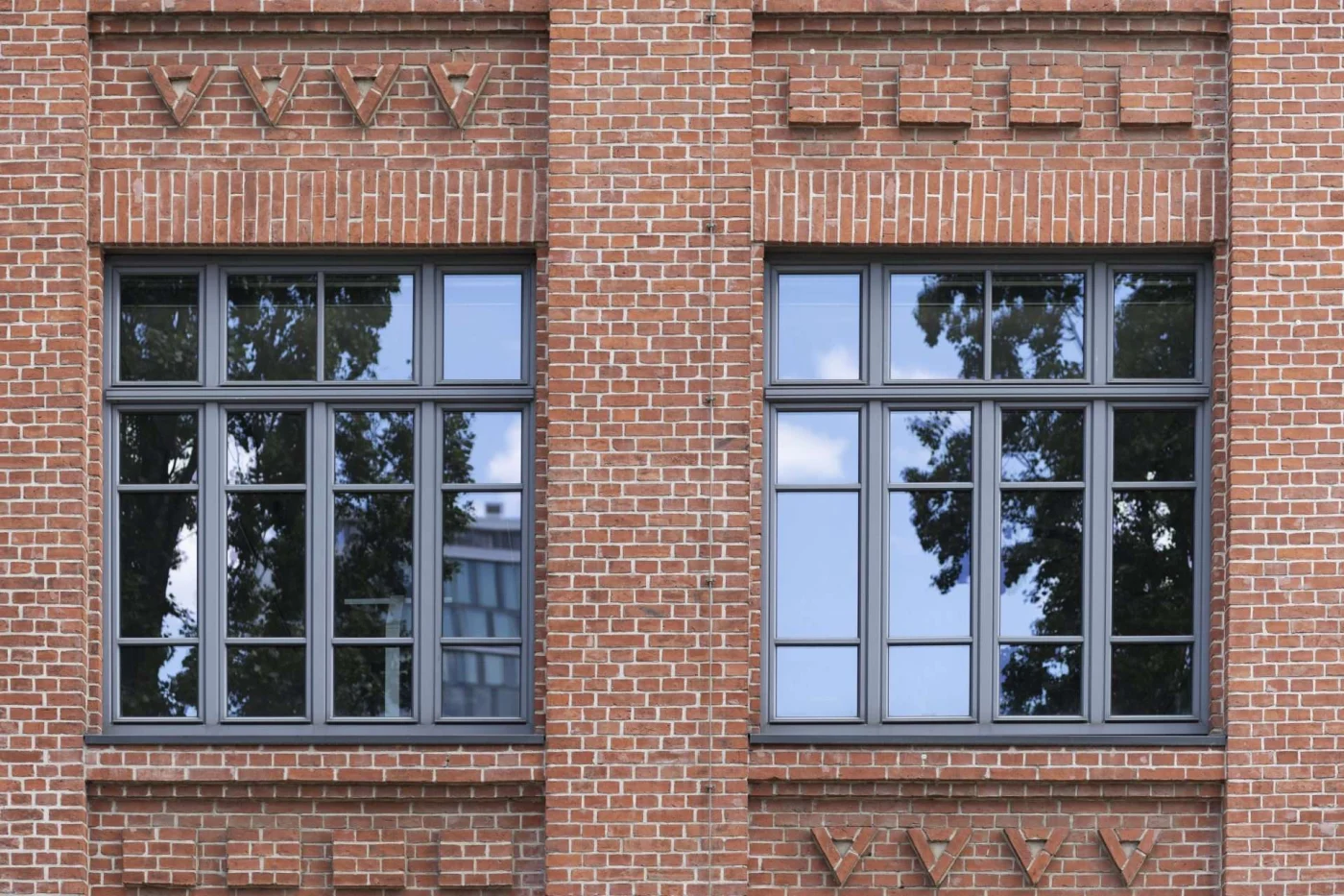 Amazing Architectural Windows in Greenwich, CT | Rockman Windows & Doors A stunning interior with floor-to-ceiling architectural windows looking out to a lush landscape.